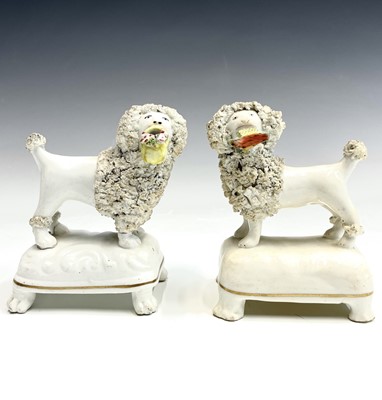 Lot 912 - A pair of Staffordshire porcelaneous figures...