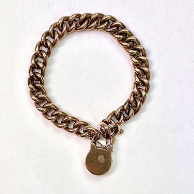 Lot 623 - A 9ct rose gold curb link bracelet with...