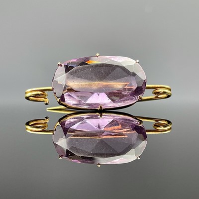 Lot 716 - A high purity gold amethyst set brooch, the...