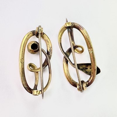 Lot 708 - A near pair of gold open work oval brooches,...