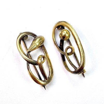 Lot 708 - A near pair of gold open work oval brooches,...