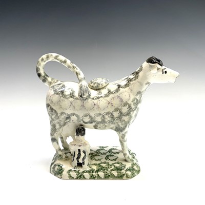 Lot 919 - A pottery cow creamer, circa 1800, with...