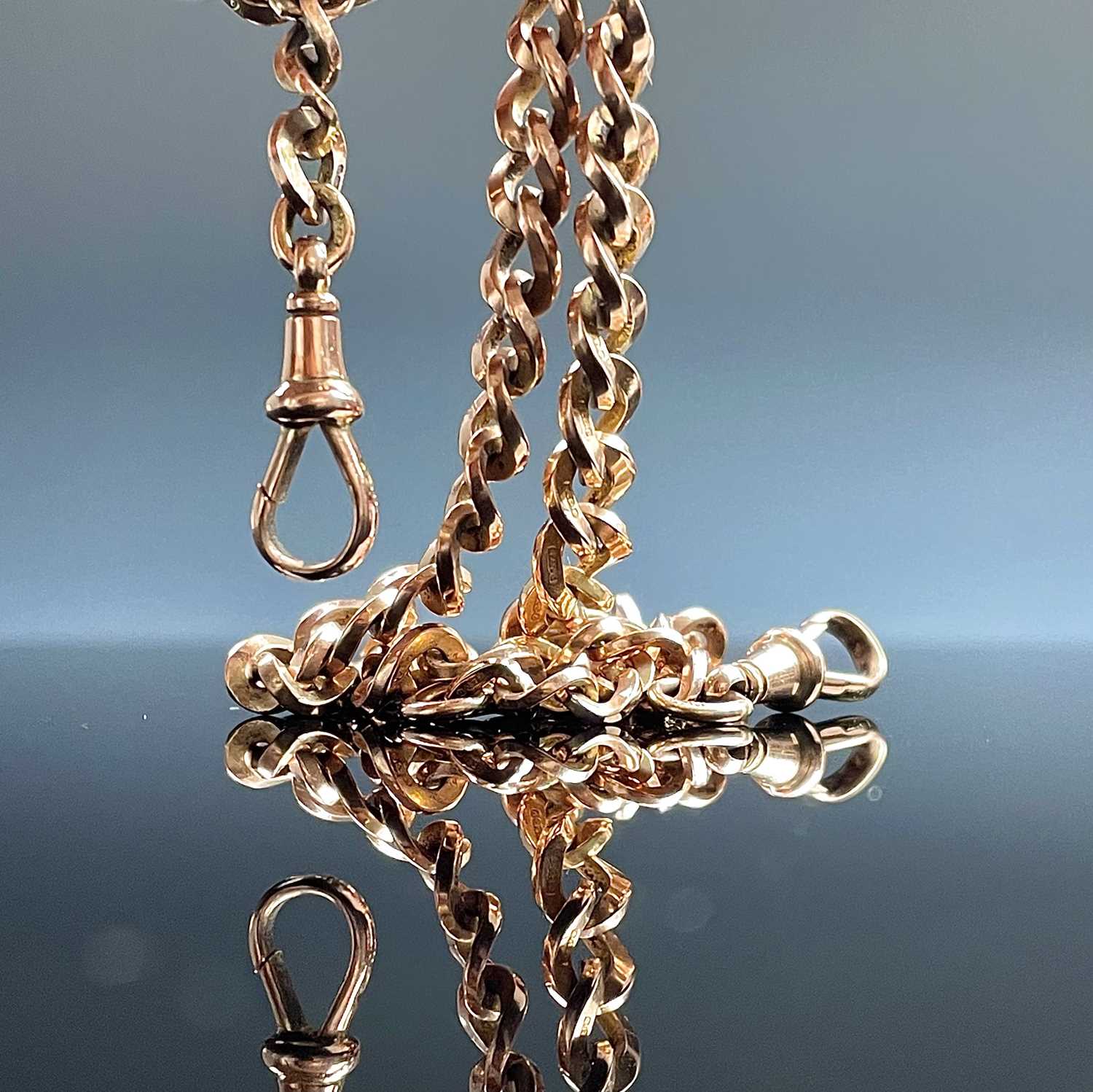 Lot 617 - A 9ct rose gold curb link Albert watch chain,...