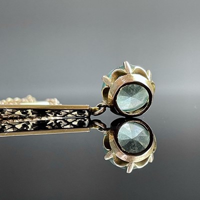 Lot 607 - A 9ct gold zircon set pendant necklace, the...