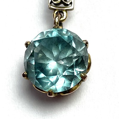 Lot 607 - A 9ct gold zircon set pendant necklace, the...