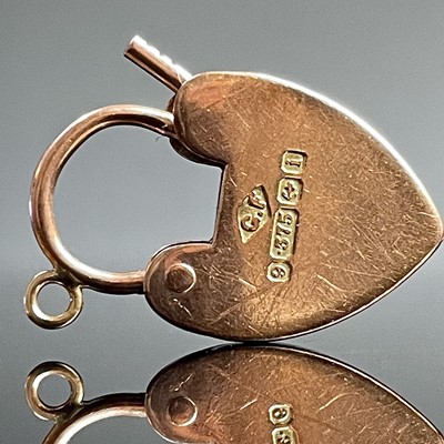Lot 668 - A 9ct hallmarked gold padlock clasp; together...