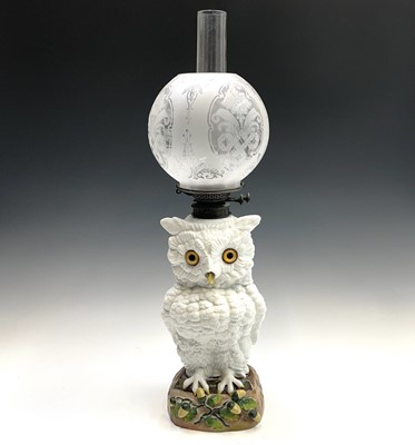 Lot 928 - A large German porcelain owl oil lamp, late...