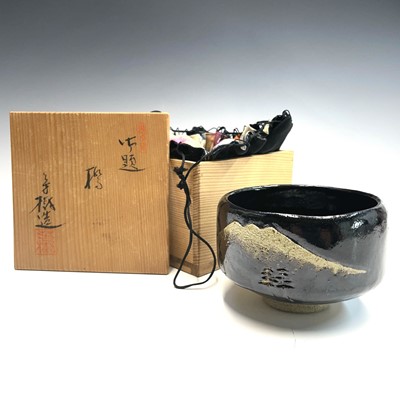 Lot 234 - A Japanese stoneware chawan, signed, the...