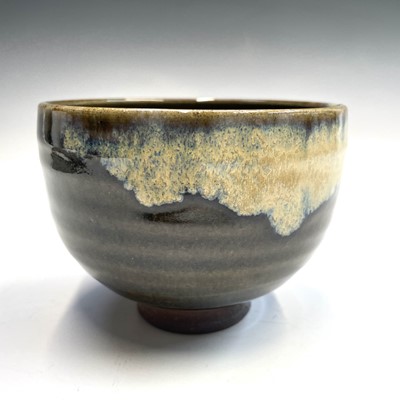 Lot 235 - A Japanese stoneware green glazed chawan,...