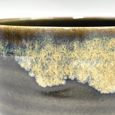 Lot 235 - A Japanese stoneware green glazed chawan,...