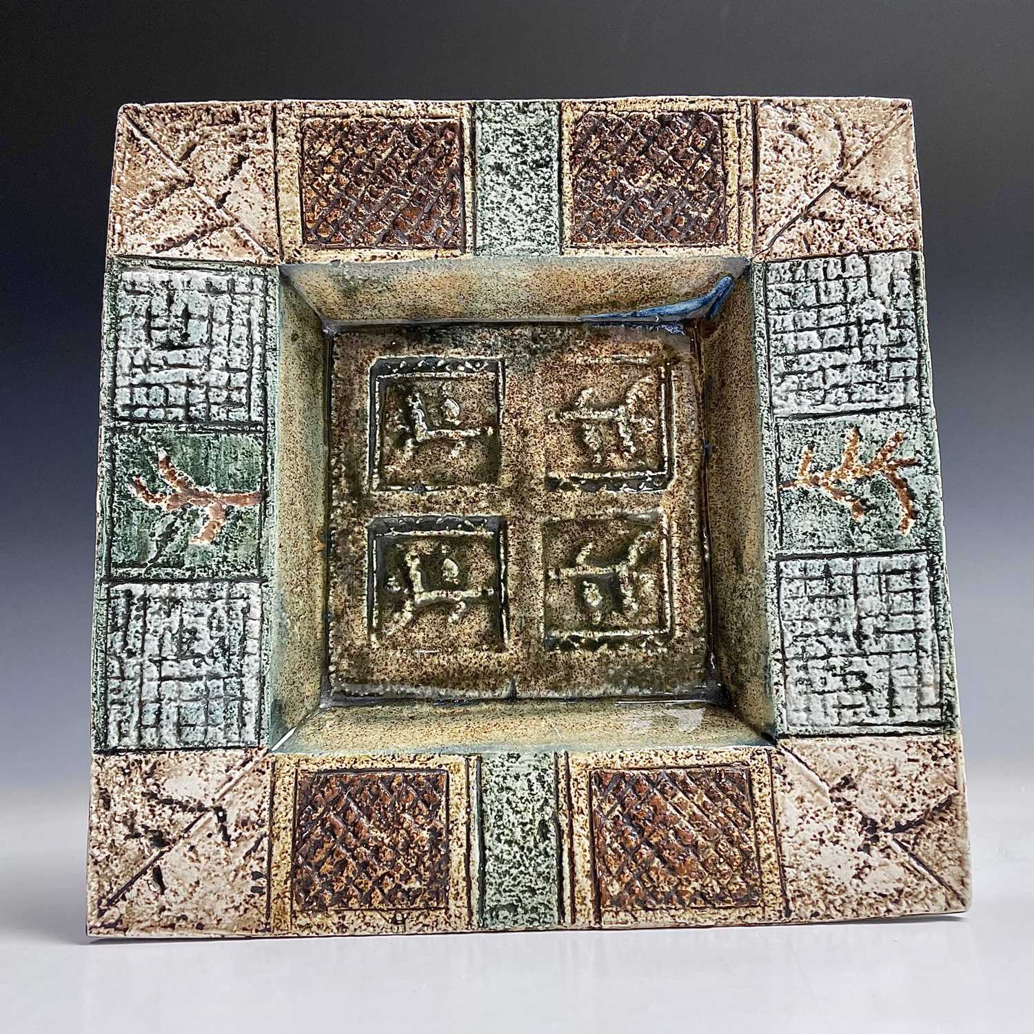 Lot 1043 - A Troika pottery square dish, decorated by...