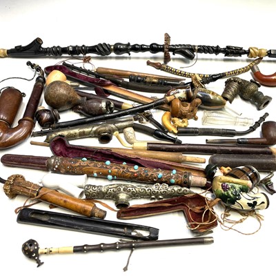 Lot 363 - A collection of pipes and smoking...