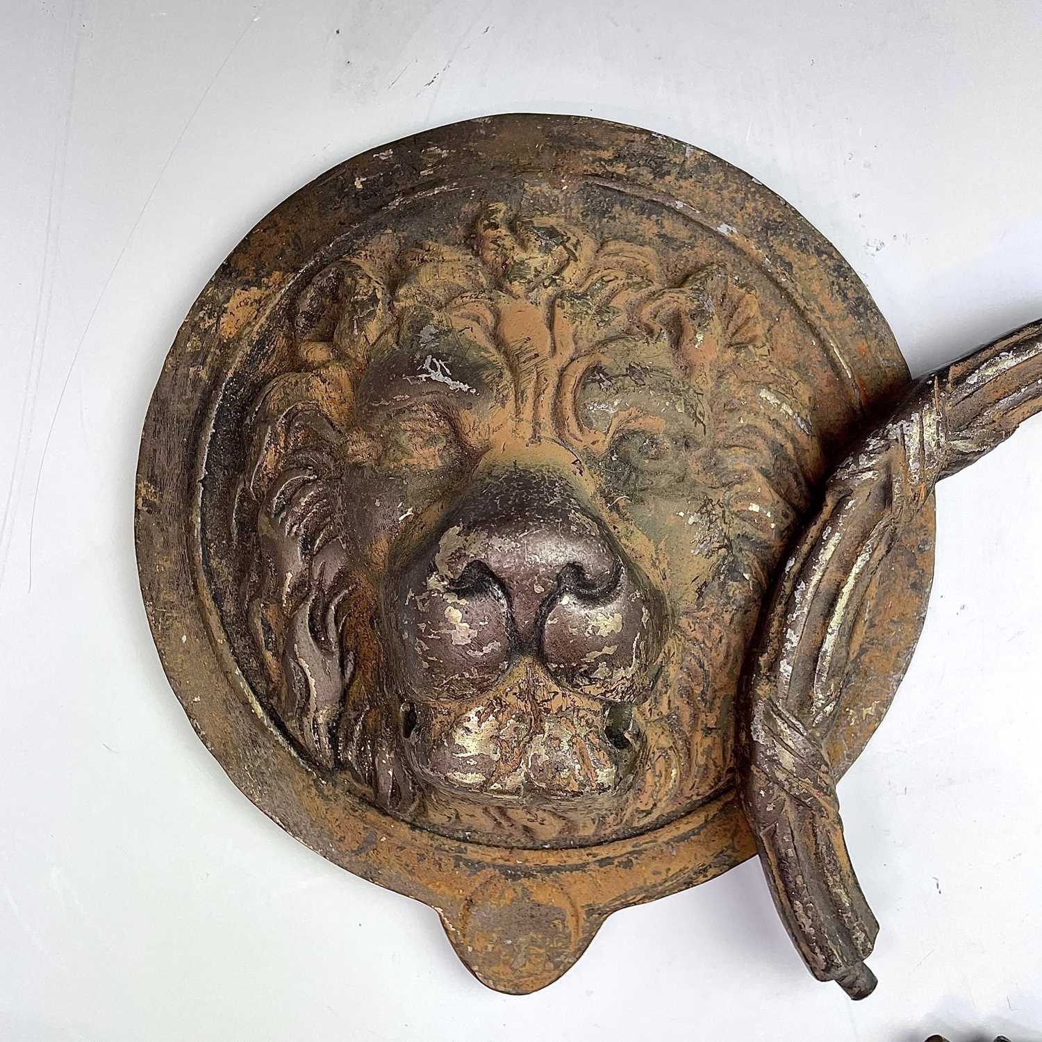 Lot 300 - A substantial brass door knocker, 20th