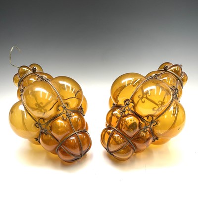 Lot 303 - A pair of Venetian blown amber glass and...