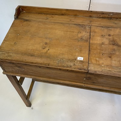 Lot 3117 - A pine clerk's desk, with two sloping lift-up...