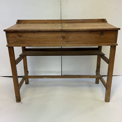 Lot 3117 - A pine clerk's desk, with two sloping lift-up...