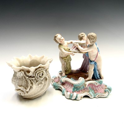 Lot 962 - A Belleek porcelain vase modelled in twisted...