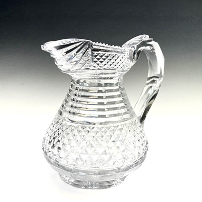 Lot 943 - A Georgian cut glass jug, with stepped and...