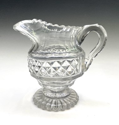 Lot 943 - A Georgian cut glass jug, with stepped and...