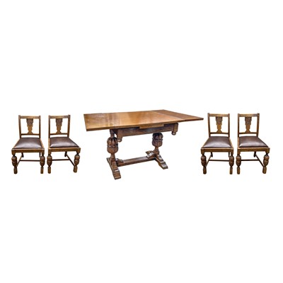 Lot 3106 - A 1920/30's oak draw leaf dining table and a...