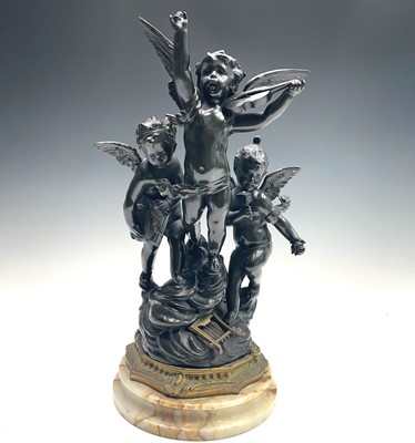 Lot 29 - After Rousseau, a bronze group of three...