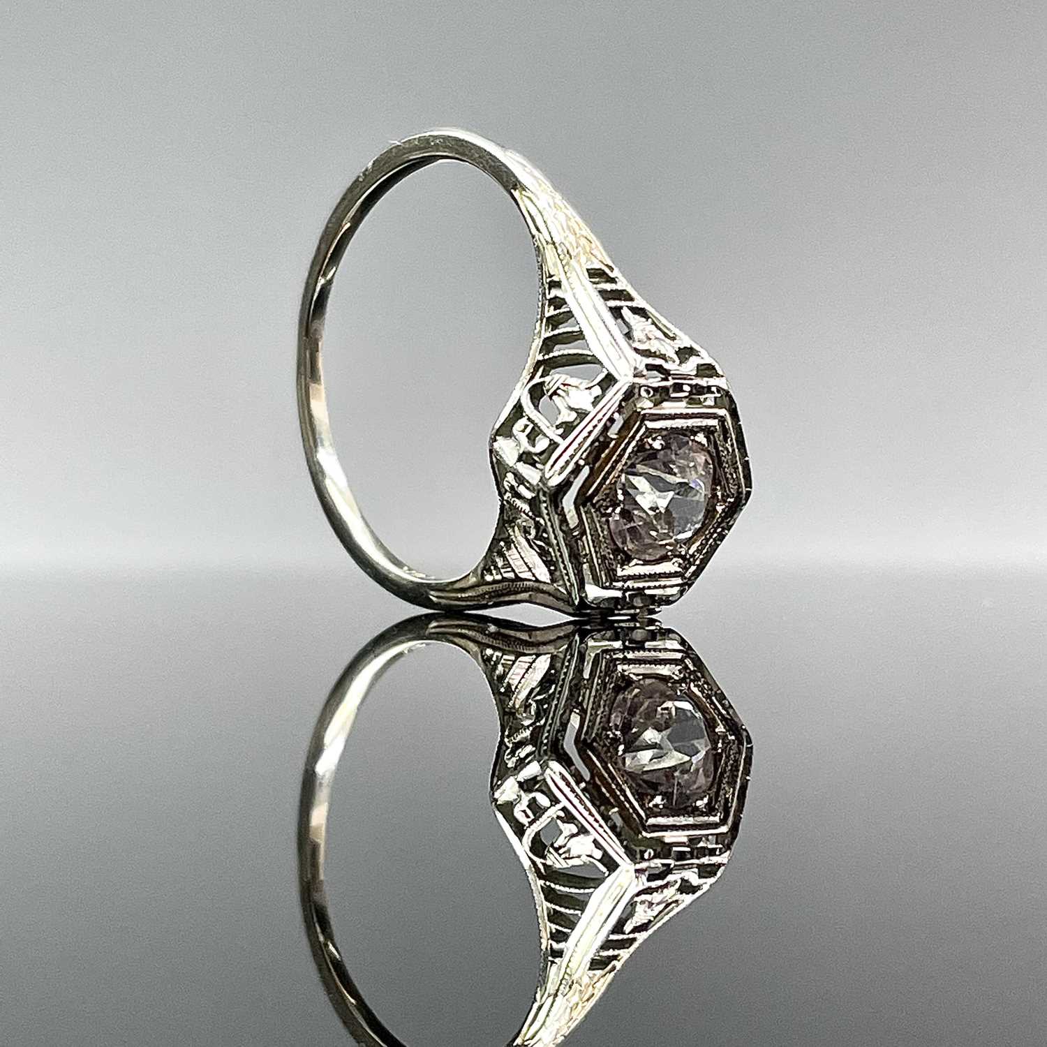 Lot 680 - An18ct white gold white stone set ring,...