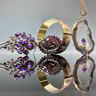 Lot 903 - A 1960's silver and amethyst floral brooch,...