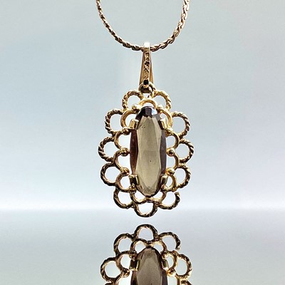 Lot 838 - A 9ct gold smokey quartz set pendant necklace,...