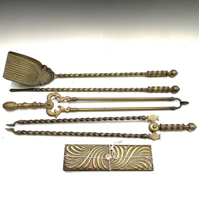 Lot 366 - A set of three Victorian Gothic brass fire...