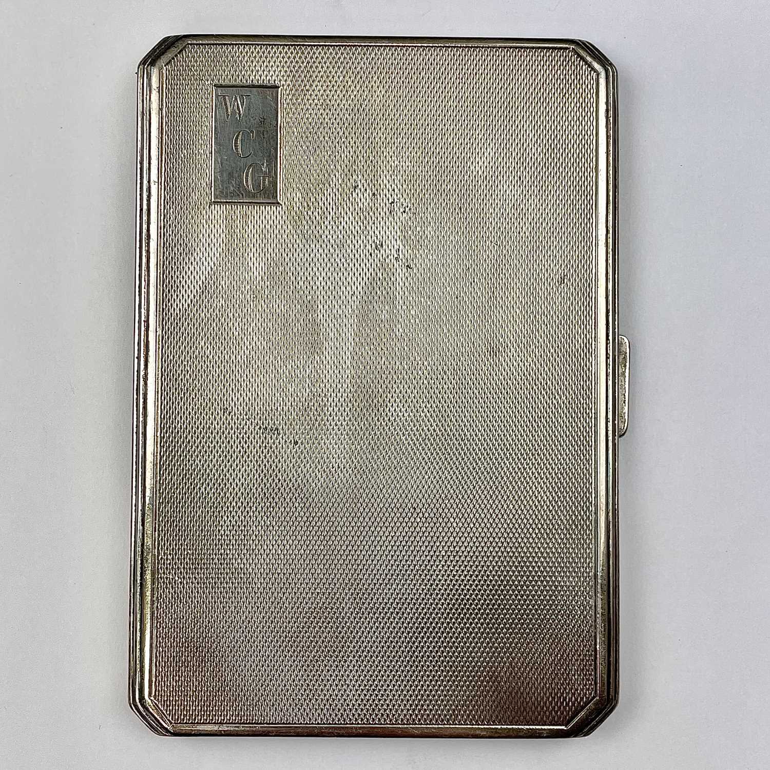 Lot 128 - A George VI silver engine turned cigarette