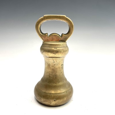 Lot 31 - A set of five Victorian brass bell weights.