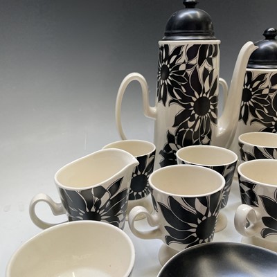 Lot 872 - A Carlton ware black sunflower pottery tea and...