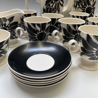 Lot 872 - A Carlton ware black sunflower pottery tea and...