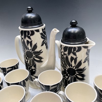 Lot 872 - A Carlton ware black sunflower pottery tea and...