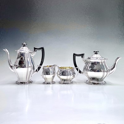 Lot 141 - A good George V silver four piece tea set by...
