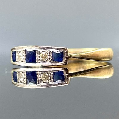 Lot 756 - An 18ct gold and platinum diamond and sapphire...