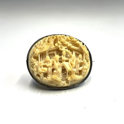 Lot 254 - A Chinese Canton carved ivory brooch, 19th...