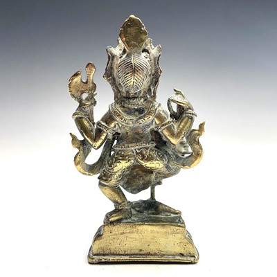 Lot 1037 - An Indian brass figure of Ganesha, early 20th...