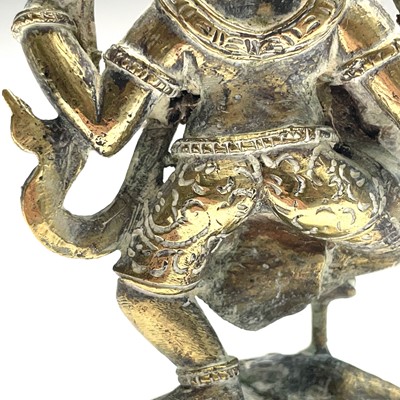 Lot 1037 - An Indian brass figure of Ganesha, early 20th...