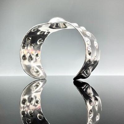 Lot 802 - A contemporary .999 fine silver heavy bangle,...