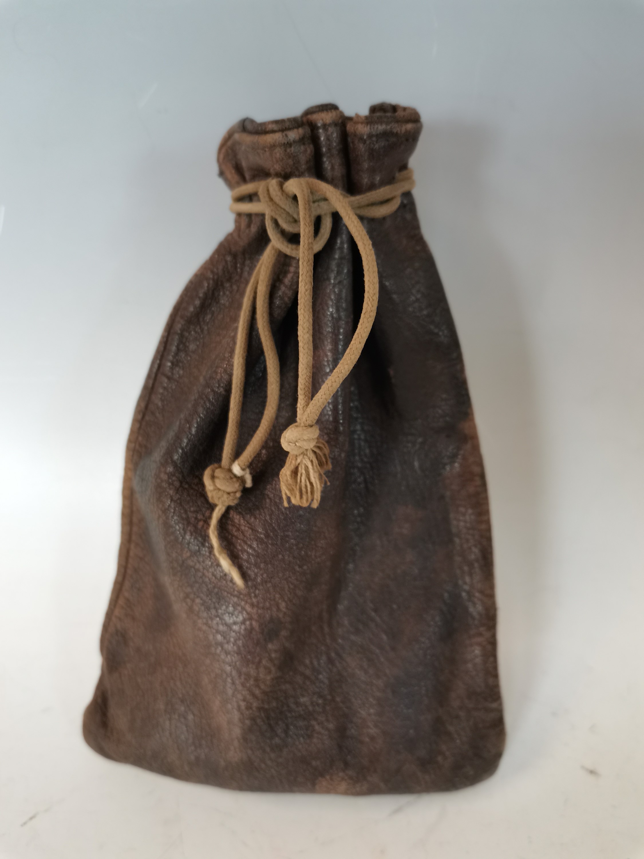 Lot 15 An antique leather money pouch with
