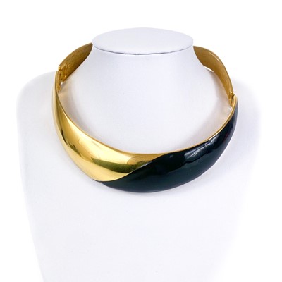 Lot 279 - An Alexis Kirk gilt metal and black enamel hinged choker.