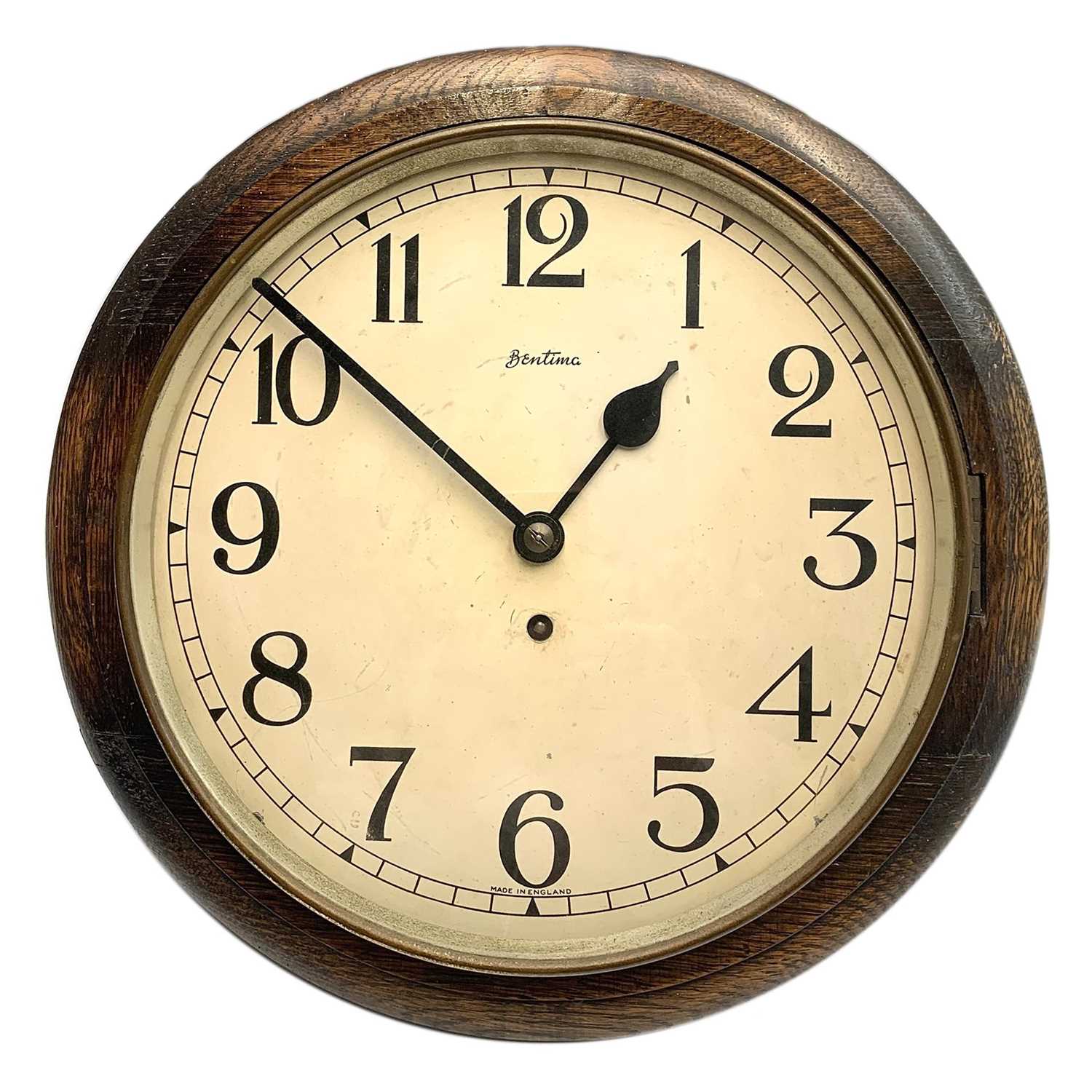 Lot 41 - An English Bentima circular oak cased wall clock, circa 1920's.