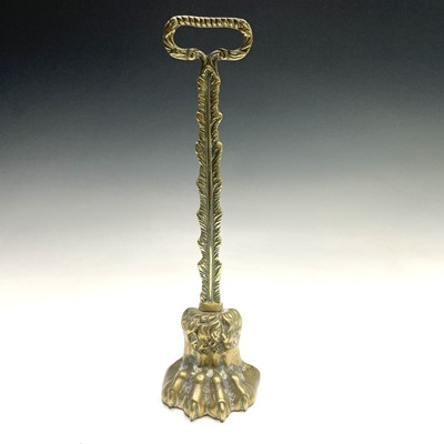 Lot 317 - A Victorian brass lion's paw doorstop, height...