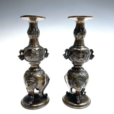 Lot 335 - Two Japanese bronze candlesticks, Meiji period,...