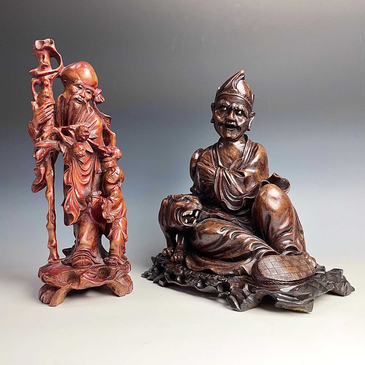 Lot 108 - A Chinese hardwood carved figure of a man with...