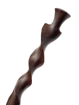Lot 168 - A primitive chip carved hardwood walking stick,...