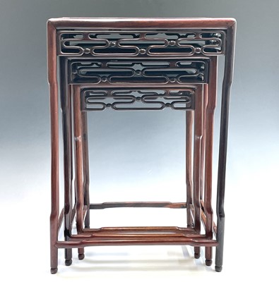 Lot 351 - A Chinese hardwood nest of three tables, 20th...