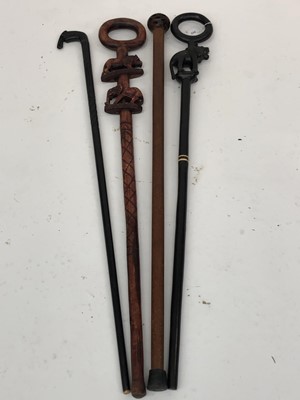 Lot 235 - A turned oak walking stick, with seed pod knop,...