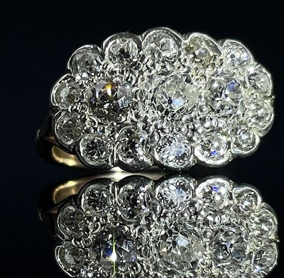 Lot 664 - An 18ct diamond cluster 17 stone ring, the...